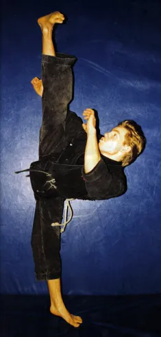 Rick Tew in a standing split kick